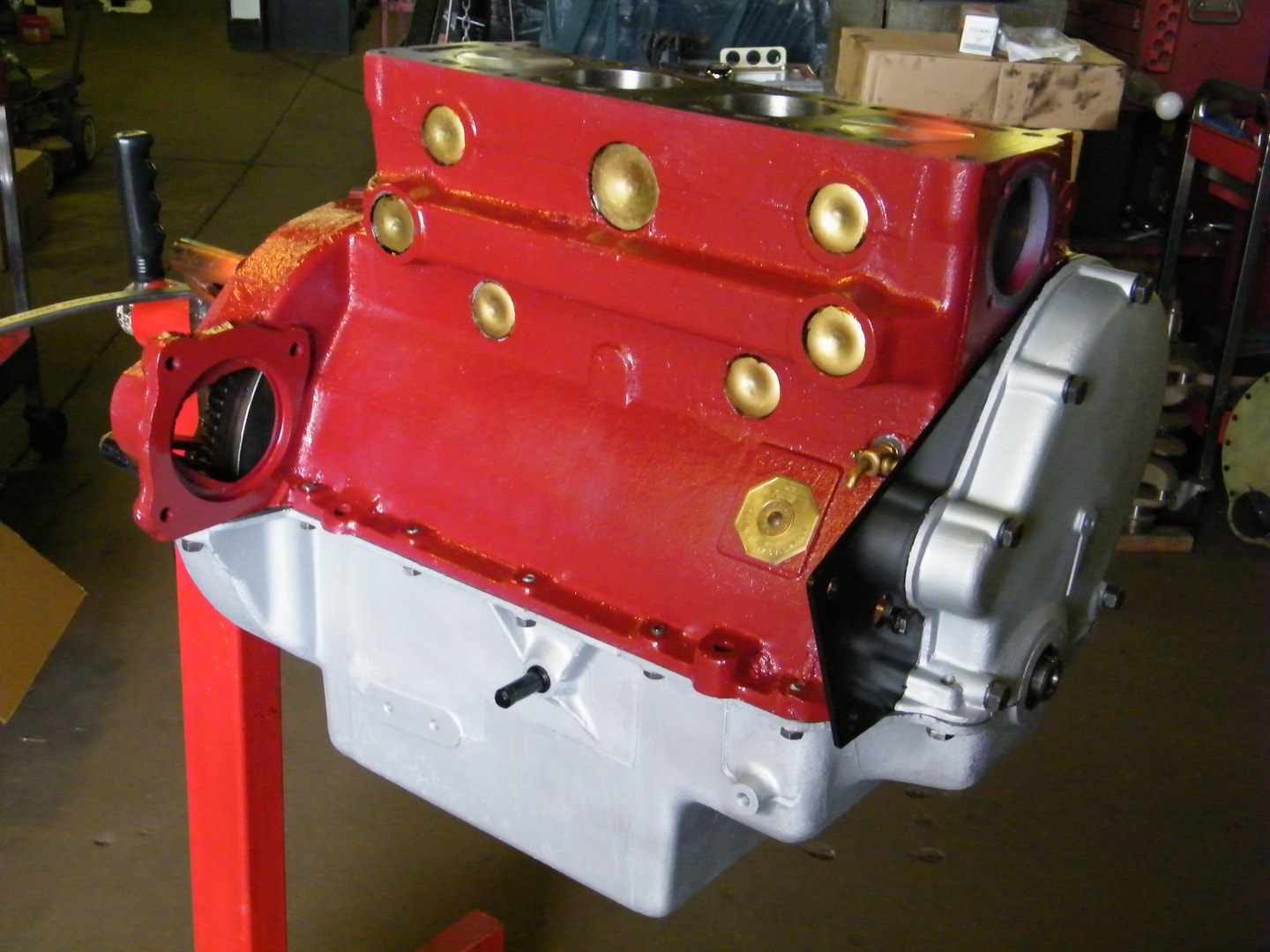 Red engine block with brass fittings