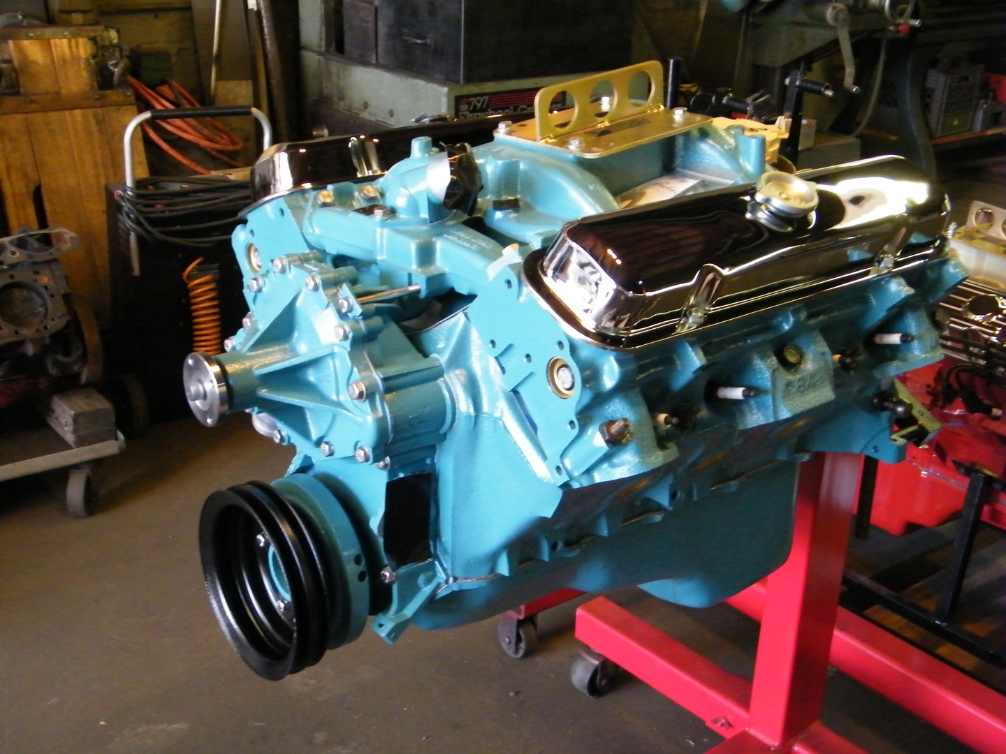 Restored blue vintage car engine workshop